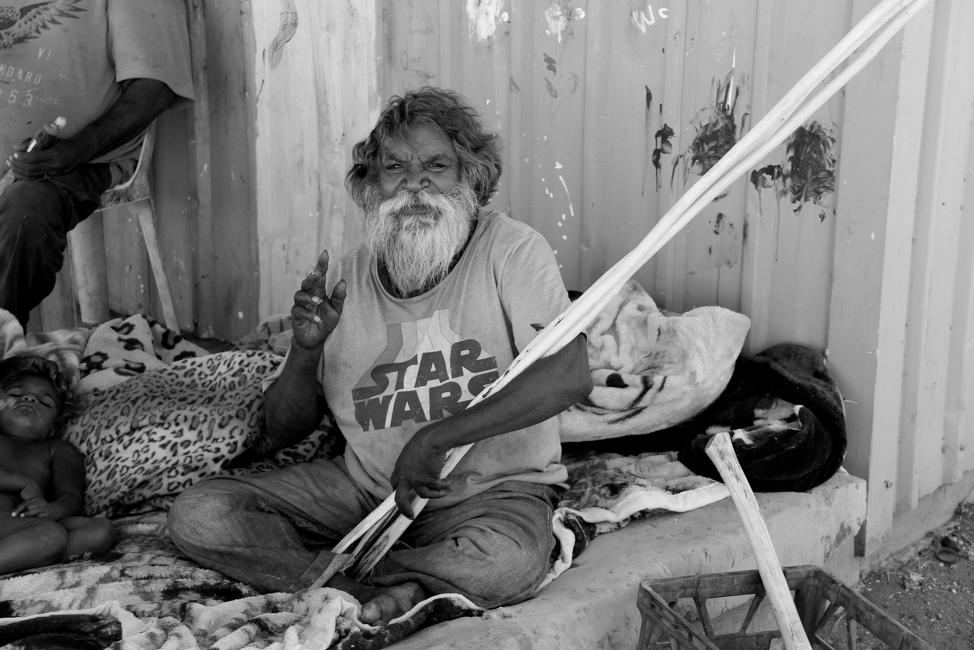 Warlimpirrnga Tjapaltjarri, a Pintupi man, with 'kulatas' (spears)