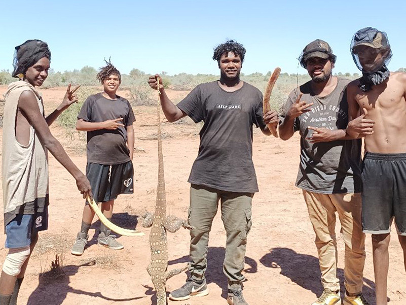 Youth-with-goanna